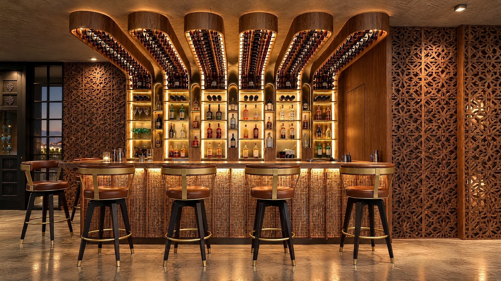 The bar at Garnet: a walnut back-bar lit in brass, bottles in arched niches, leather stools