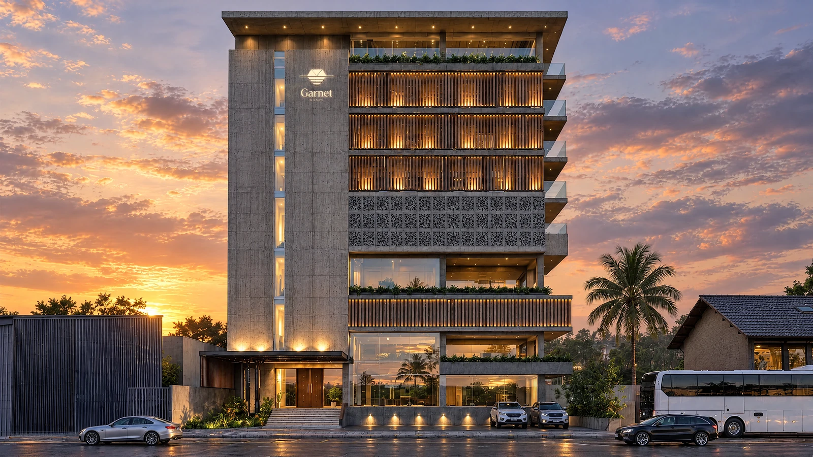 The front of Garnet at dusk, lit timber screens and the sign on the concrete fin