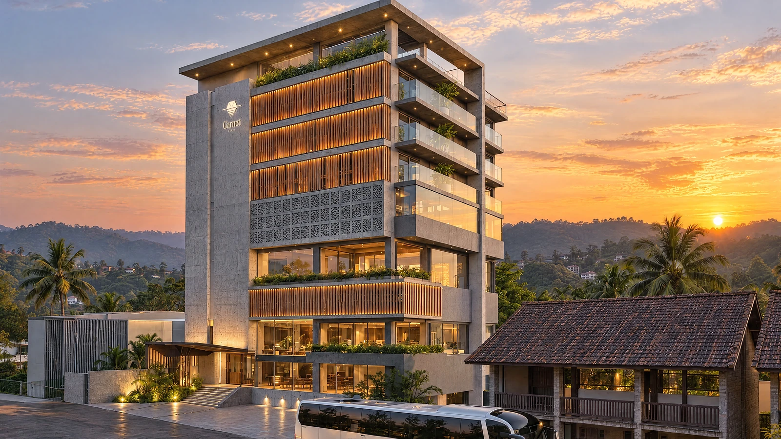Garnet, Kandy, at sunset: the concrete fin, timber screens and the hills behind